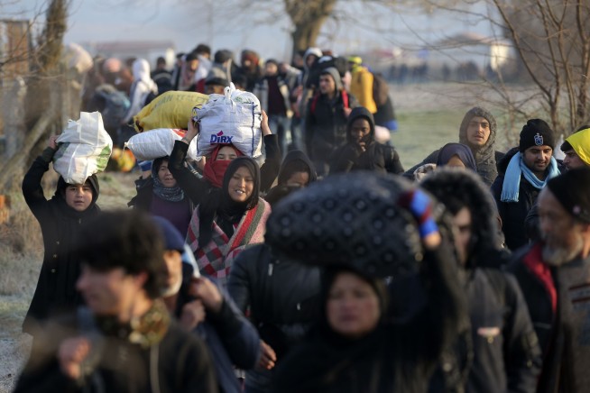 Turkey, Syria fighting escalates; refugees mass at EU border