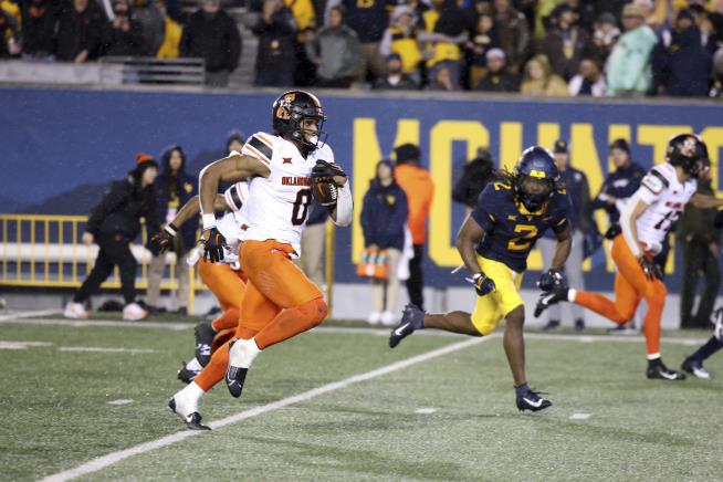 Gordon romps for 282 yards, 4 TDs, Oklahoma State outlasts West