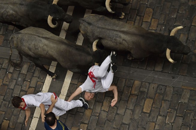 American gored at Pamplona bull run promises to run again