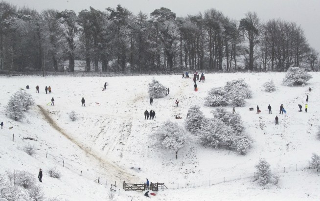 AP PHOTOS: Harsh weather hits Europe, but also brings fun