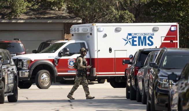 3 Texas officers shot by gunman, who holds 3 people in home