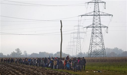 The Latest: A woman and 2 children drown off Greek island