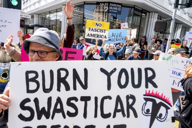 Protests against Elon Musk's purge of US government swarm Tesla showrooms