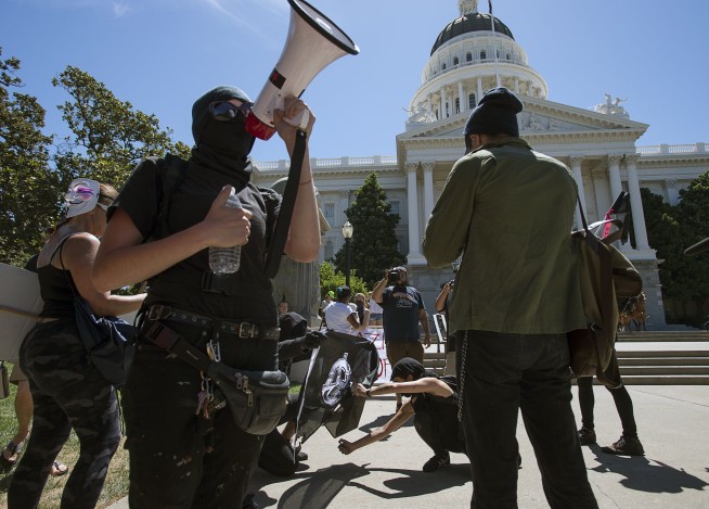 10 stabbed, beaten at white nationalist rally in California