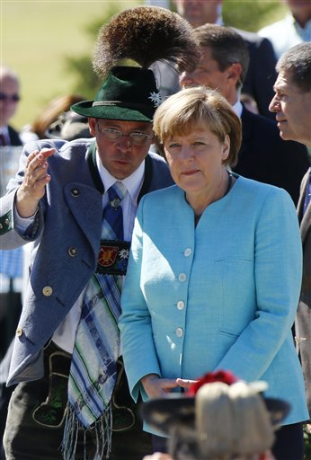 THE LATEST: Obama praises Merkel, celebrates US-German ties
