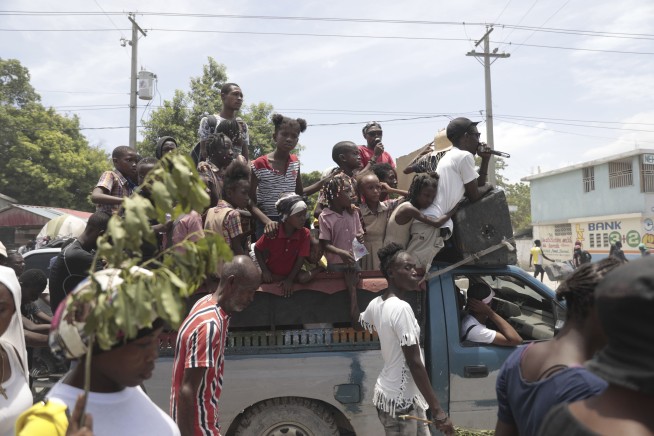 Haitians, weary of gang violence, protest the kidnapping of an American nurse and her daughter