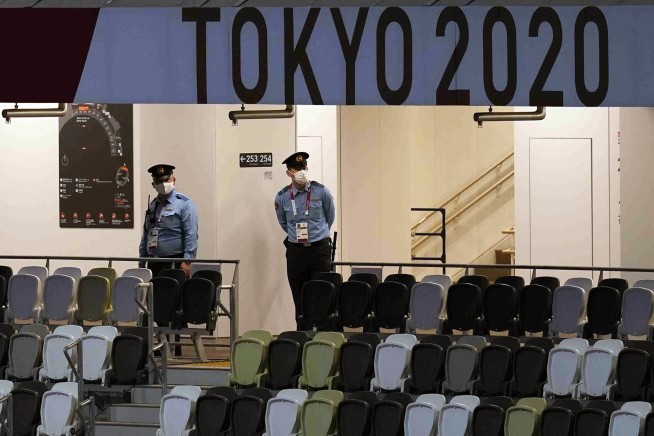 The Latest: A mostly empty Olympic Stadium awaits opening