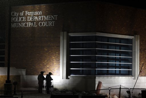 US clears officer in Ferguson case, criticizes police force