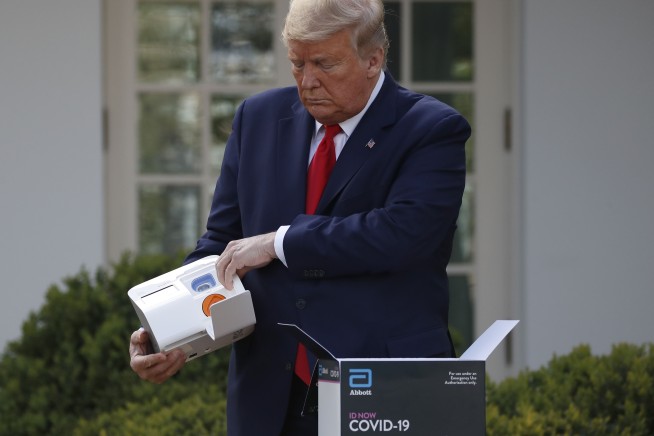 Trump defends extending virus guidelines as spread continues