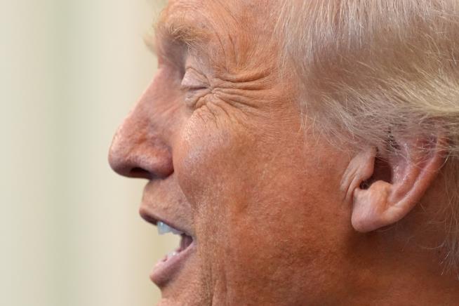 The Latest: Trump says he has commuted the sentence of former US Rep. George Santos in fraud case