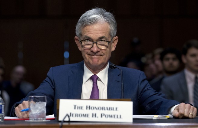 The Latest: US Fed sticks with 3 hikes next year, 1 in 2020