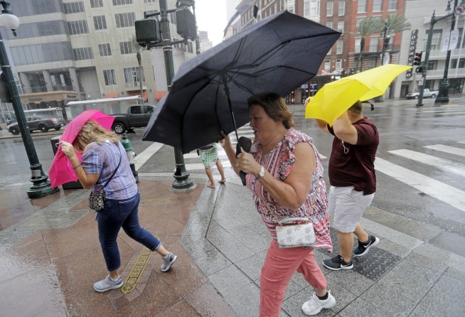 Barry's flood threat lingers as storm slowly sweeps inland