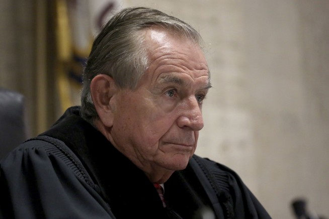 The Latest: Van Dyke barely reacts to prison sentence