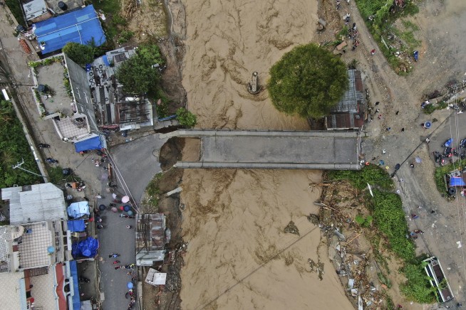 Flooding and landslides in Nepal kill at least 66 people, with as many again still missing
