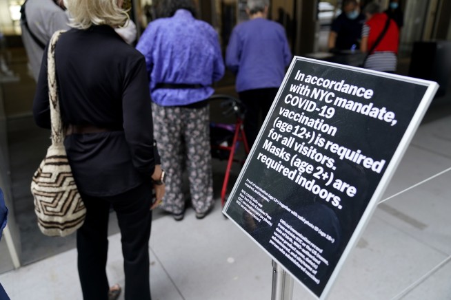 While US summer surge is waning, more mandates in the works