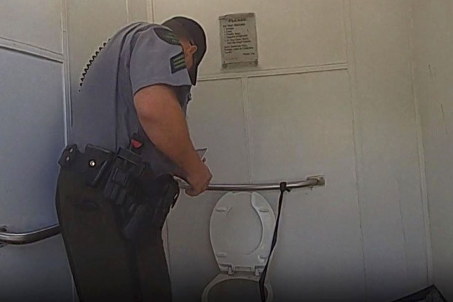 Woman rescued from outhouse toilet after climbing in to retrieve Apple Watch, Michigan police say