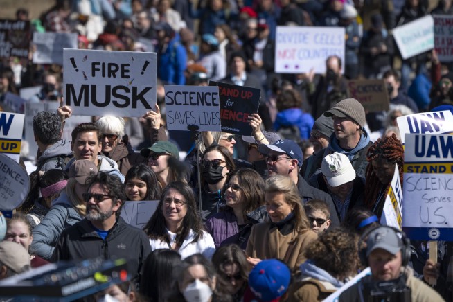 Out of the lab and into the streets, researchers and doctors rally for science against Trump cuts