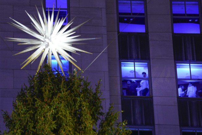 Iconic Christmas tree at Rockefeller Center illuminated in midst of pro-Palestinian protest