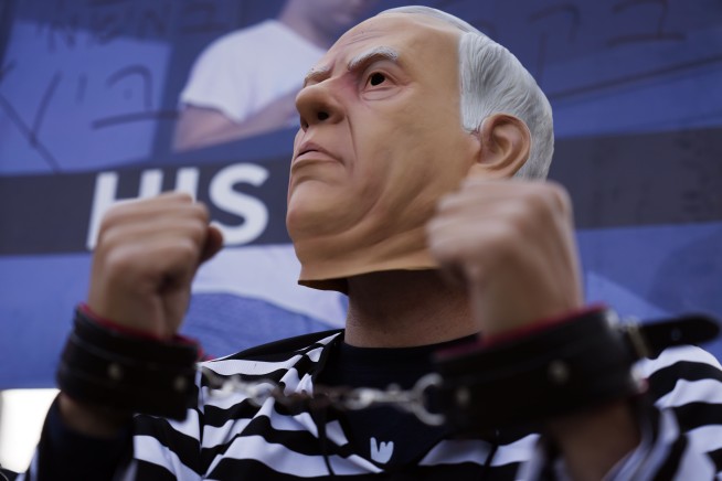 Israel's Netanyahu vows to challenge 'absurd' corruption charges as he takes the stand in his trial