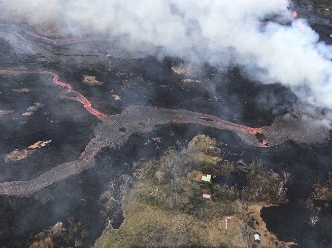 'Eerie' blue flames burn in cracks caused by Hawaii volcano