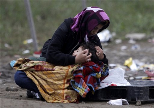 The Latest: EU: Asylum-seekers must apply in 1st EU nation