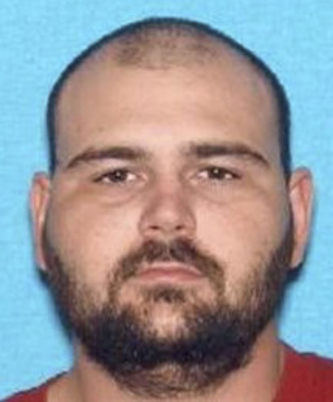 'Armed and dangerous' suspect wanted in deputy's killing
