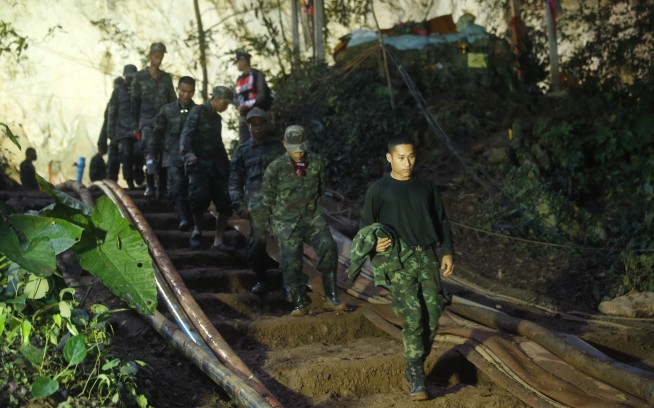 The Latest: Thai navy SEALs say soccer team healthy