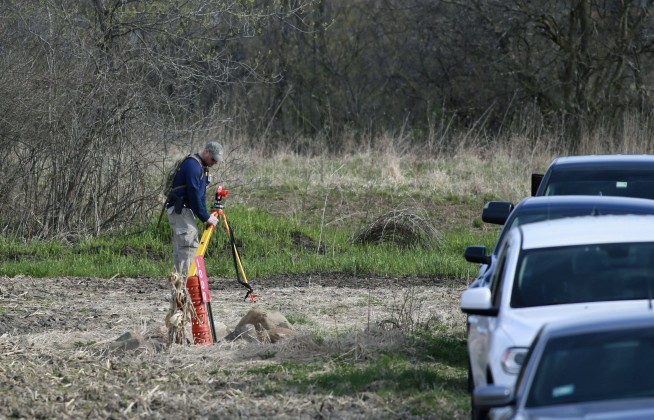 The Latest: Missing boy's body was buried in shallow grave