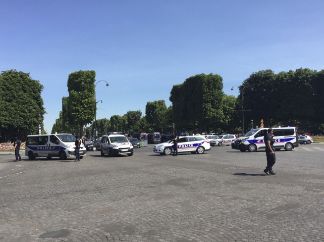 The Latest: Tourists shaken by attack on Champs-Elysees