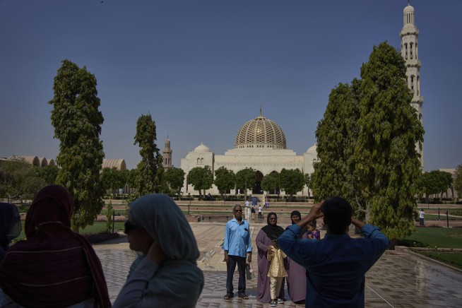 Iran and US envoys hold 1st negotiation over Tehran's nuclear program, and talk face-to-face