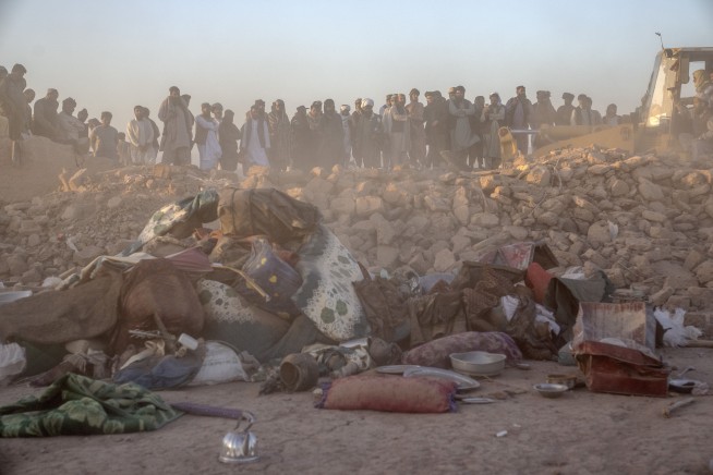 Desperate people dig out dead and injured from Afghanistan earthquakes that killed at least 2,000