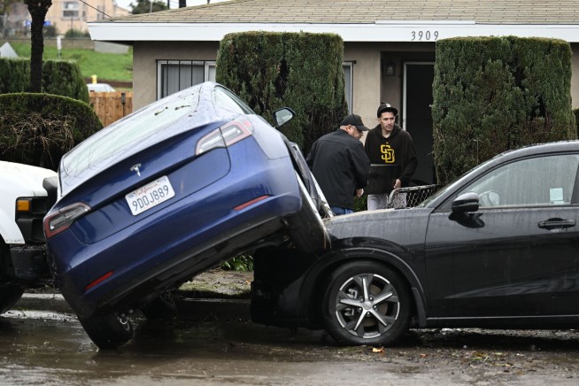 Flash floods inundate homes and overturn cars in San Diego as heavy rains sweep through much of US