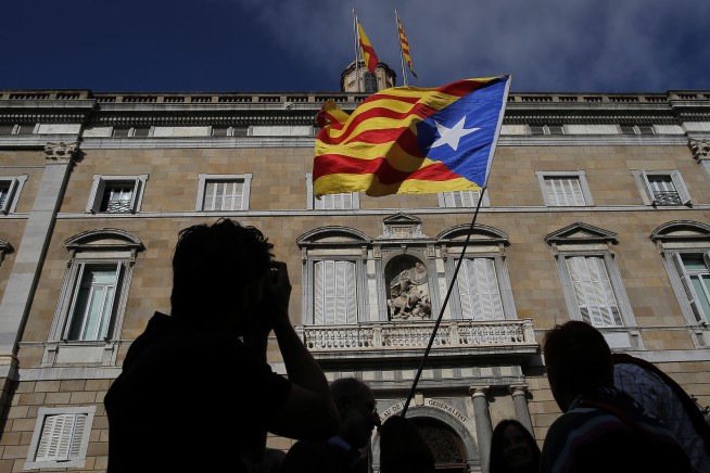 The Latest: Spain seeks charges against Catalan leaders