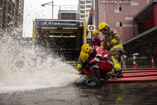 2 dead in Hong Kong amid extreme rain and flash floods that also struck southern China