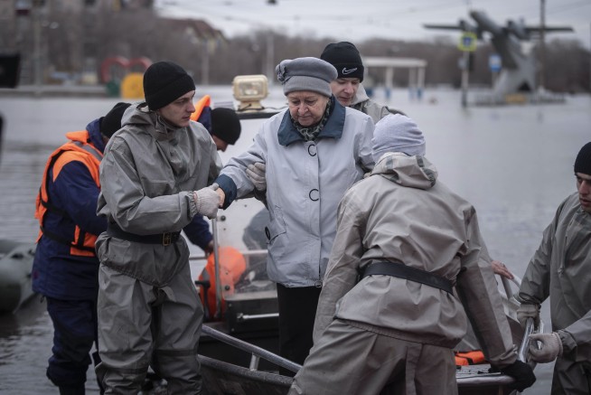 Russians stage a rare protest after a dam bursts and homes flood near the Kazakh border