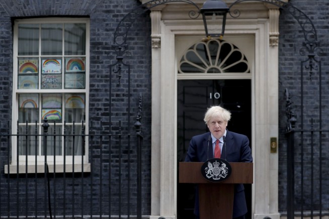 Back at work, Boris Johnson urges patience over UK lockdown