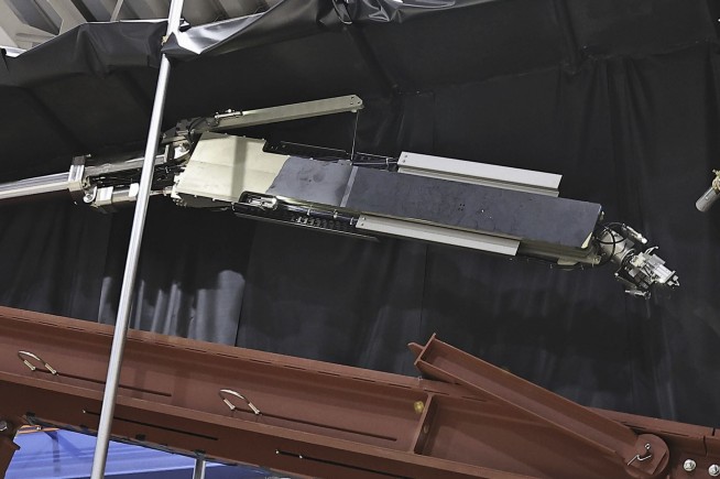 A robot retrieves the first melted fuel from Fukushima nuclear reactor