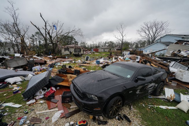 South cleans up from tornados as blizzards hit further north
