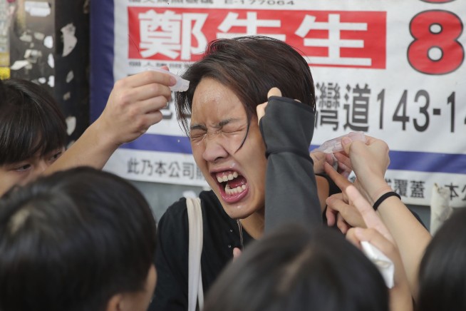 Hong Kong police shoot protester, man set on fire