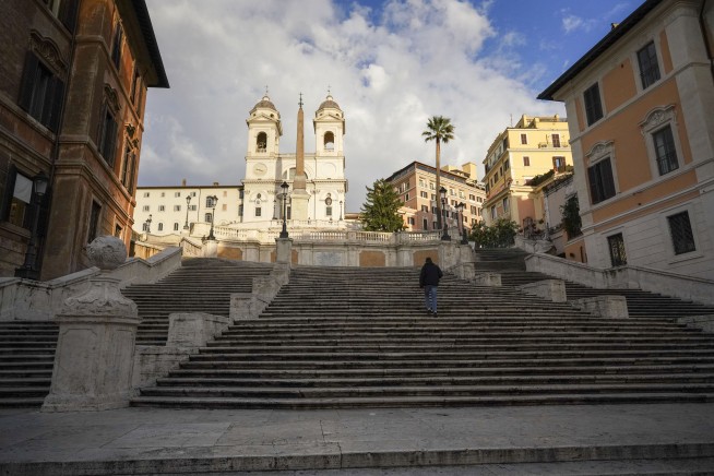 An 80-year-old drives a luxury Mercedes sedan down Rome's Spanish Steps and gets stuck