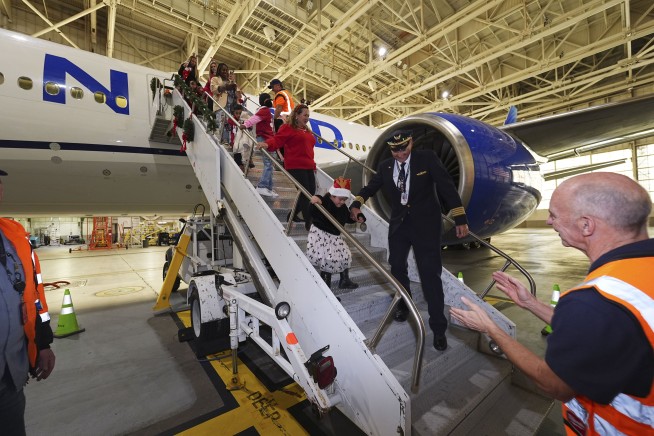 Flight takes kids to visit Santa at North Pole scene in transformed Denver airport hangar