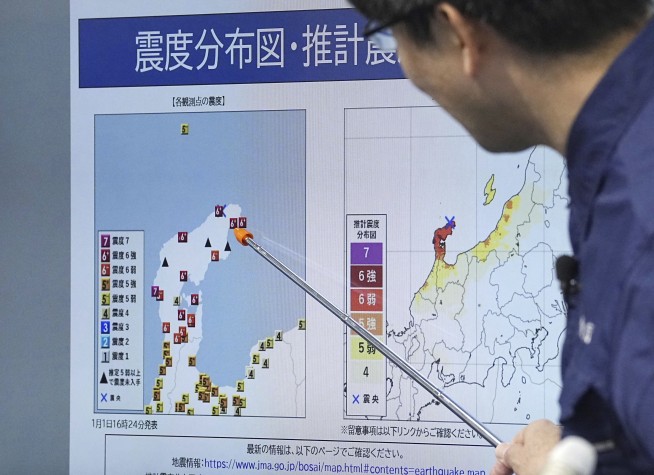 Japan lowers tsunami warning after a series of earthquakes but tells people to stay away from coast