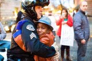 Hug Between Officer, Kid at Ferguson Rally Is a Hit