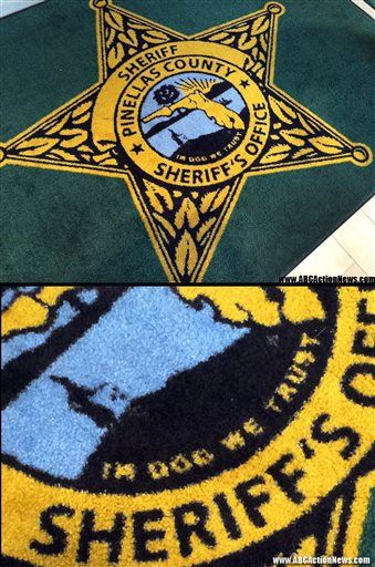 Sheriff's Rug Typo: 'In Dog We Trust'