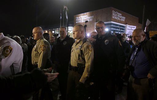 Vigil Held in Ferguson as Manhunt Continues