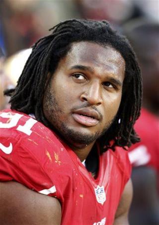 Police: NFL Player 'Assaulted Victim' as She Held Baby