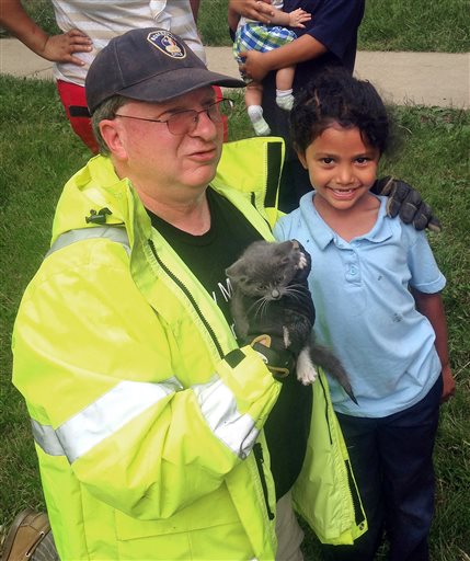 Girl Saves Kitten in Drain After Firefighters Couldn't Fit