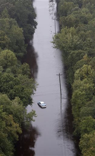 Flooding Kills 12, Serves Up 'Cruel Twist'