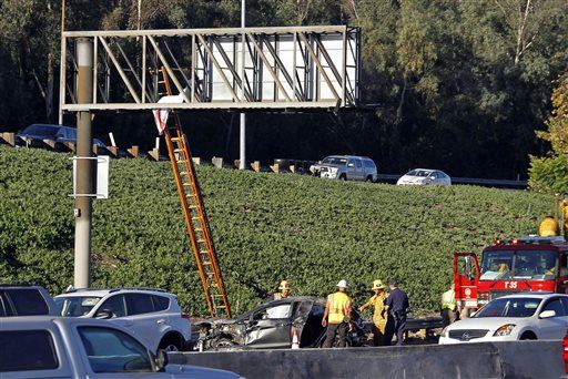 Body Lands on Freeway Sign Following Car Accident
