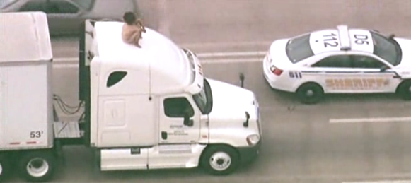 Naked Woman Atop Semi Ties Up Traffic for 2 Hours